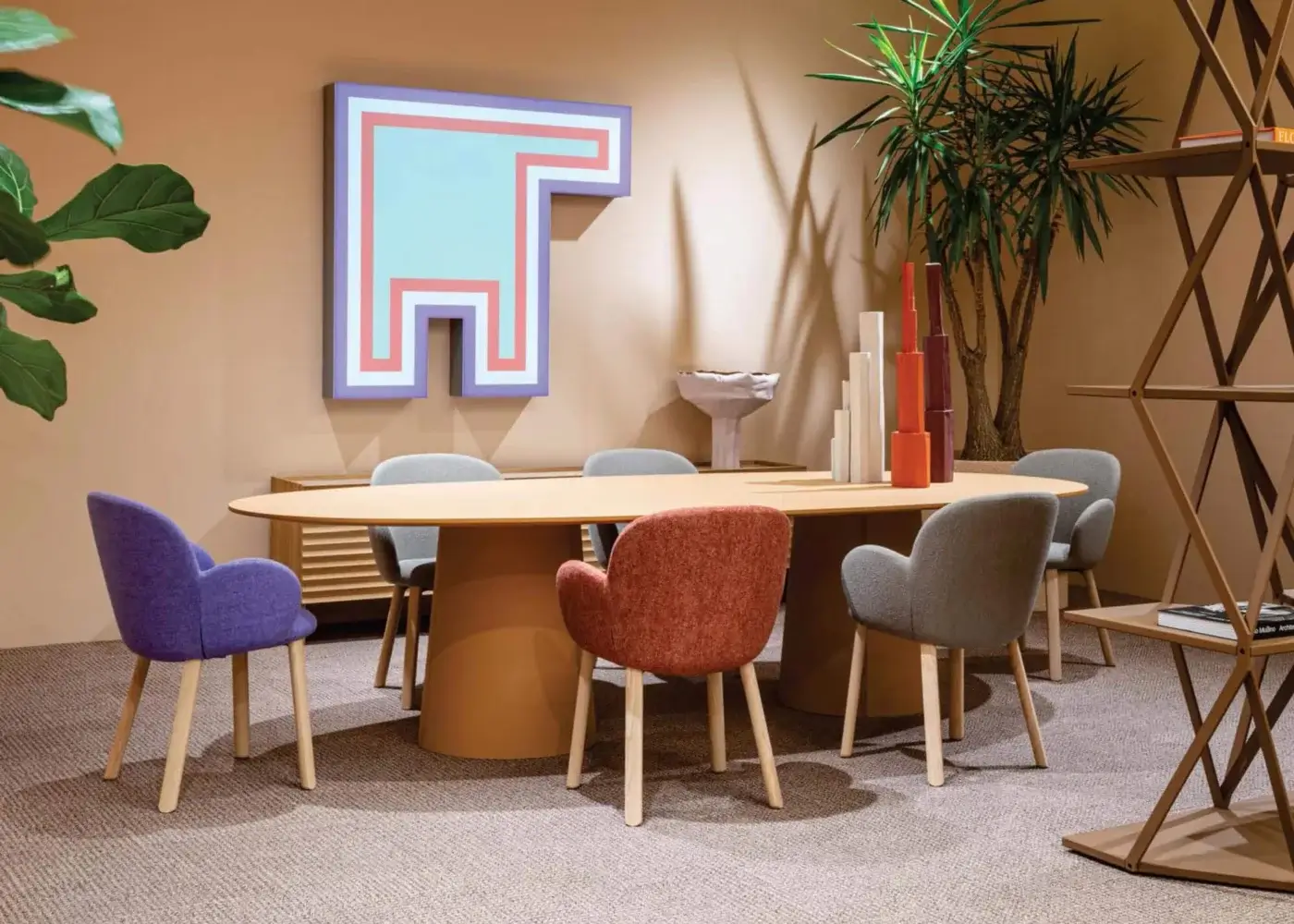 Elegant Moroso Tulp armchair with rounded silhouette upholstered in rust-red textile and anchored with ash wood legs built with a steel frame