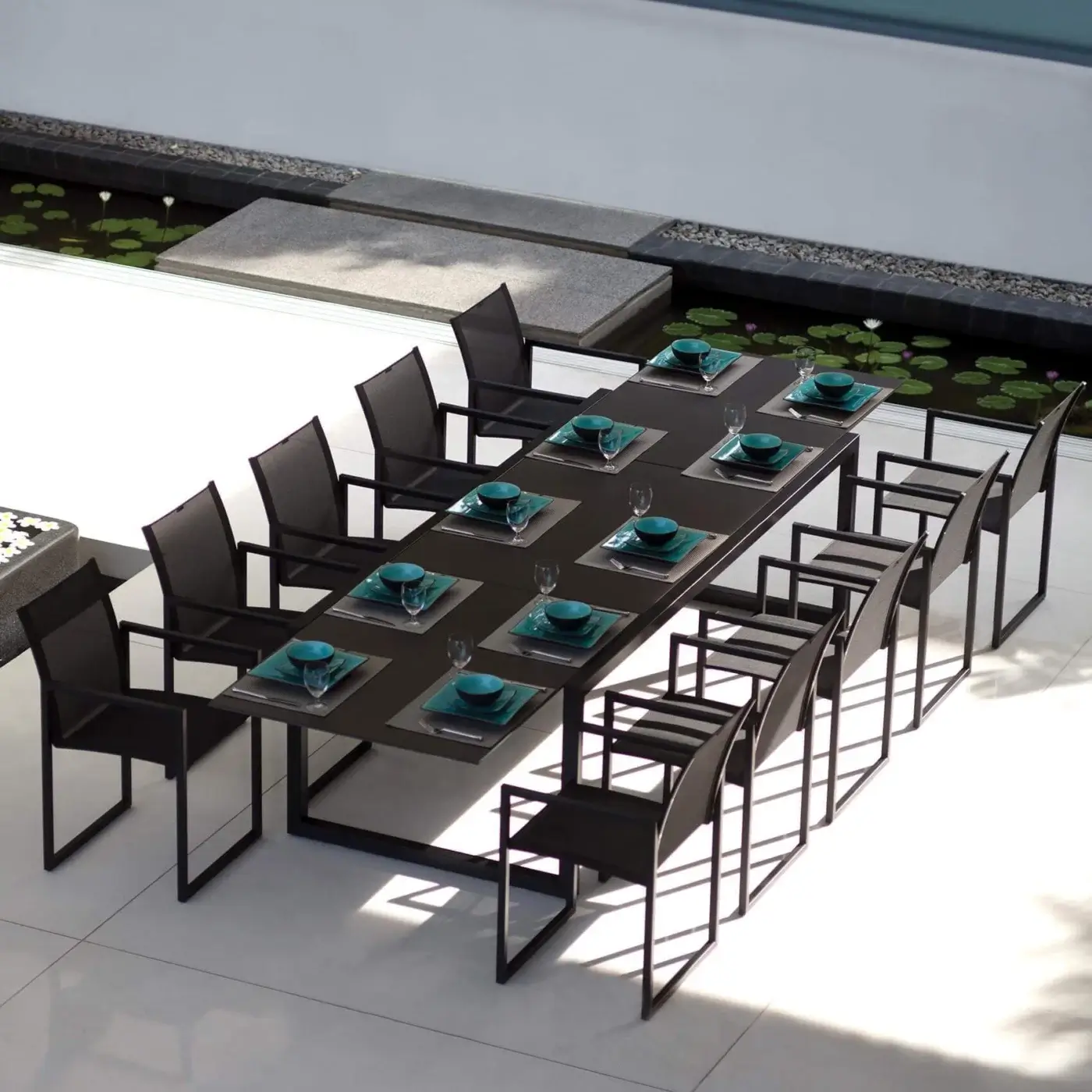 Superior Royal Botania Ninix armchair crafted with black coated stainless steel and black Batyline in a sleek matte finish