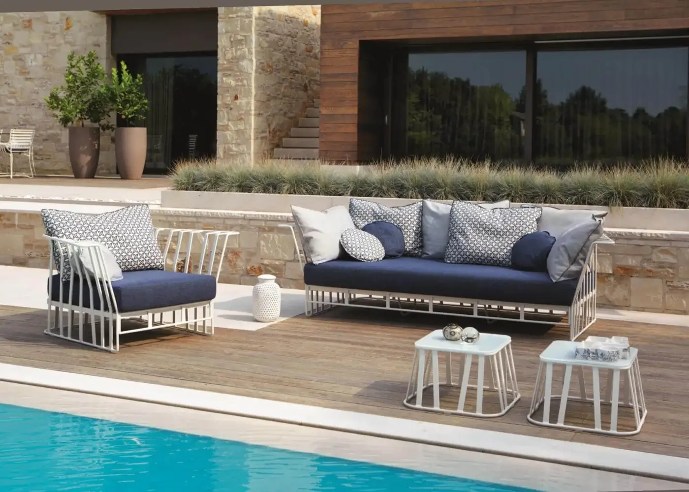 Superior Roberti Rattan Hamptons Graphics lounge chair with plush blue patterned cushions and powder coated aluminum structure