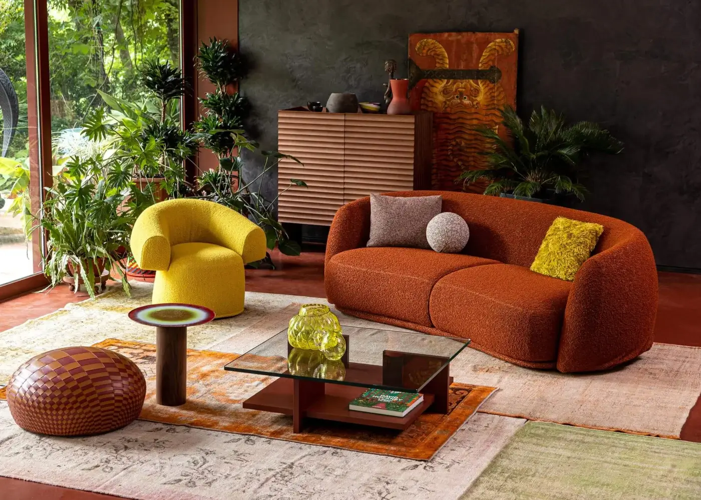 Lavish Moroso Pacific sofa with rounded silhouette upholstered in warm rusty orange textile and wooden steel structure