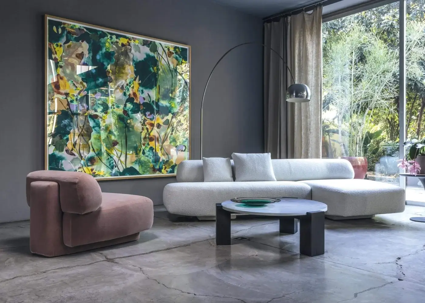 Elegant Moroso Gogan lounge chair with light pink textile upholstery and curved polyurethane foam construction