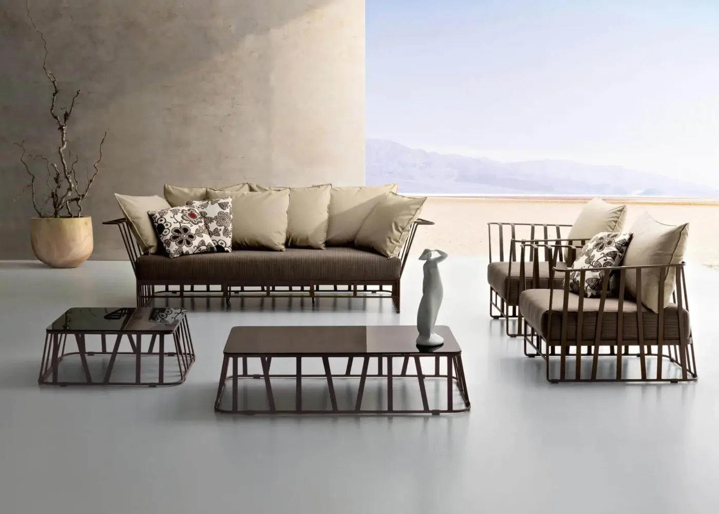Distinguished Roberti Rattan Hamptons Graphics coffee table with a lacquered glass top and powder-coated aluminum base