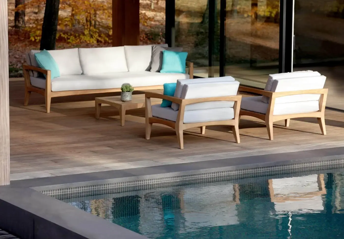 Distinguished Royal Botania Zenhit sofa with teak wood structure and light fabric seat cushions in neutral tones