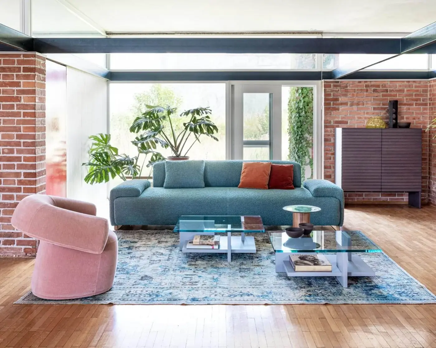Harmonious Moroso Loveland sofa in muted teal-blue textile with ash wood varnished feet and terracotta suede-like cushions