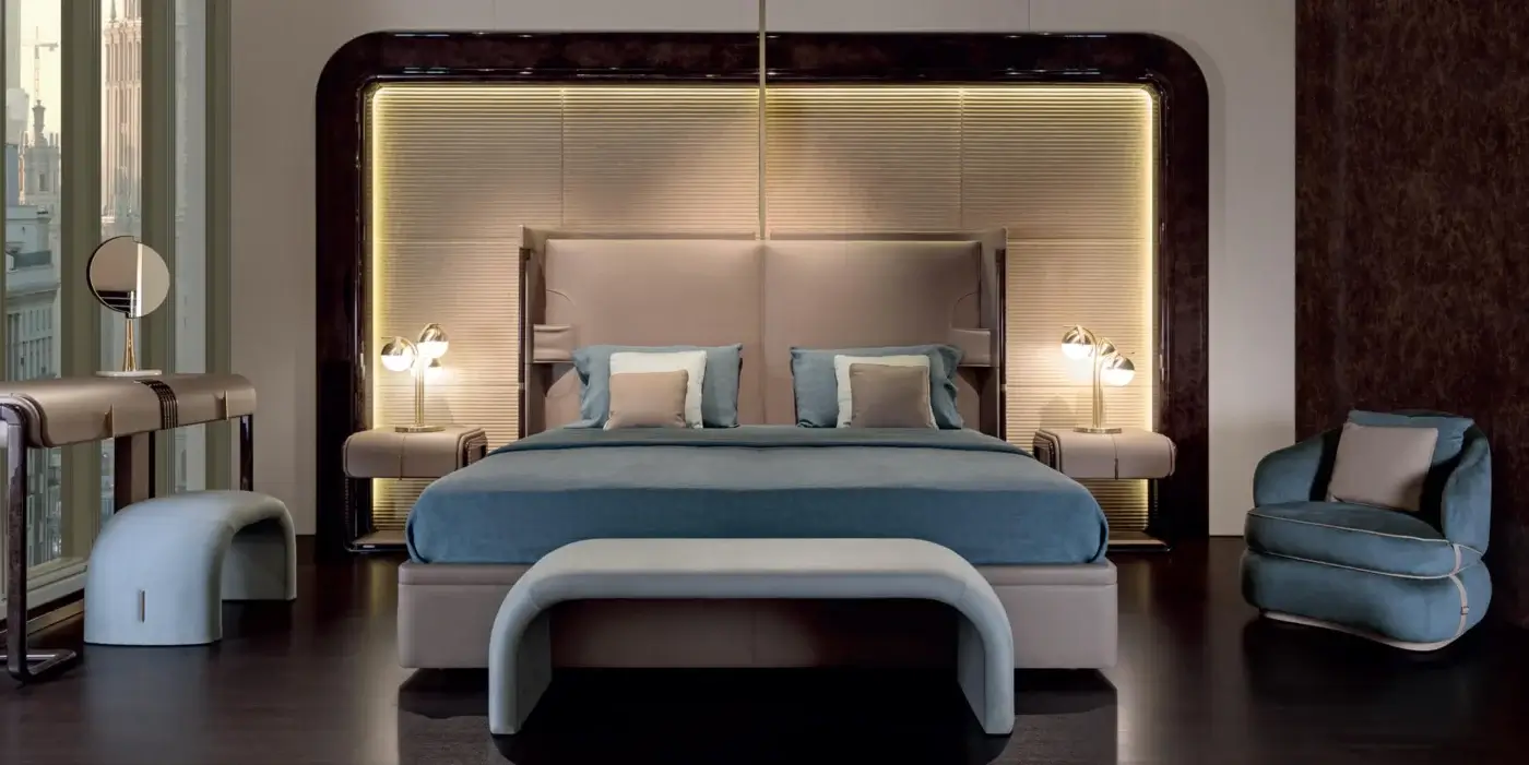 Elegant Turri Eclipse bench upholstered in light grey fabric with gold metal detail and uniform matte finish
