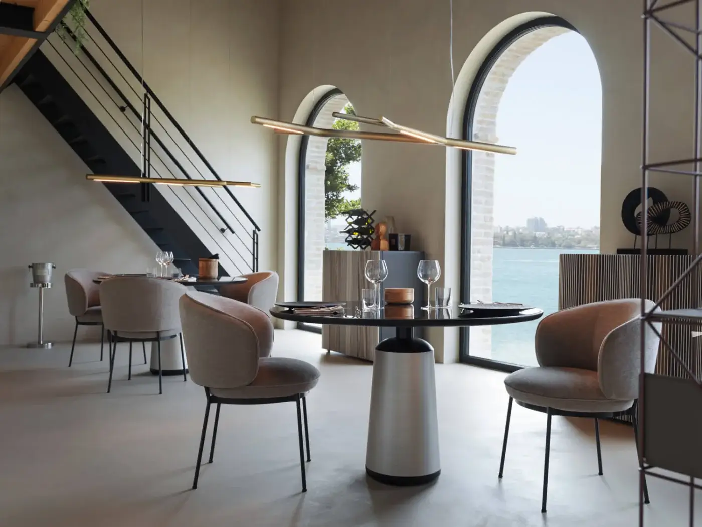 Superior Horm Aira suspension lamp crafted in brass with a warm golden finish offering a graceful illumination
