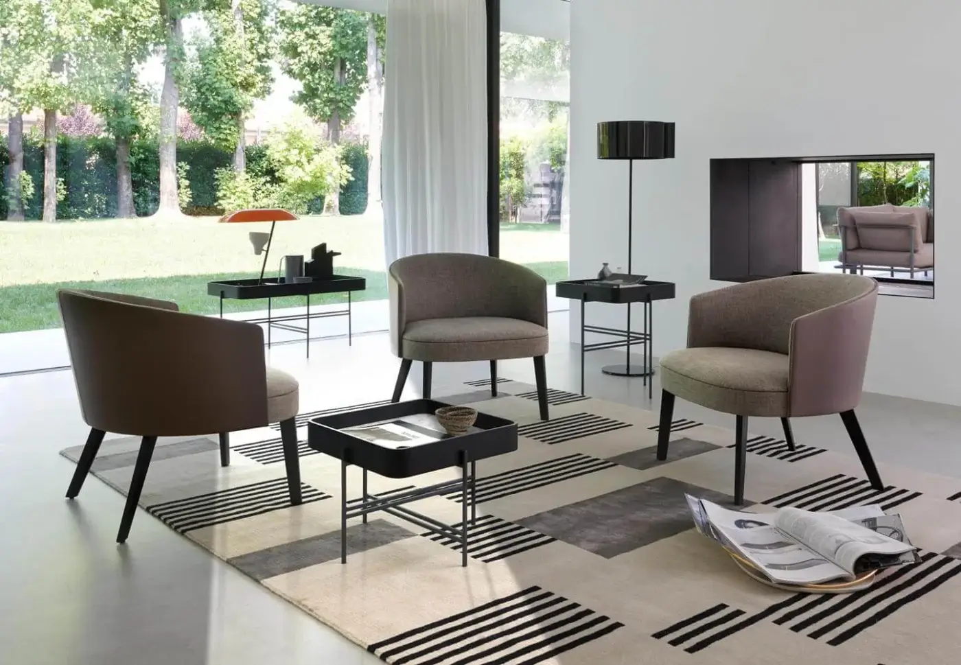 Elegant Potocco Lena lounge chair in muted brown-gray textile with solid ash legs and dark matte finish