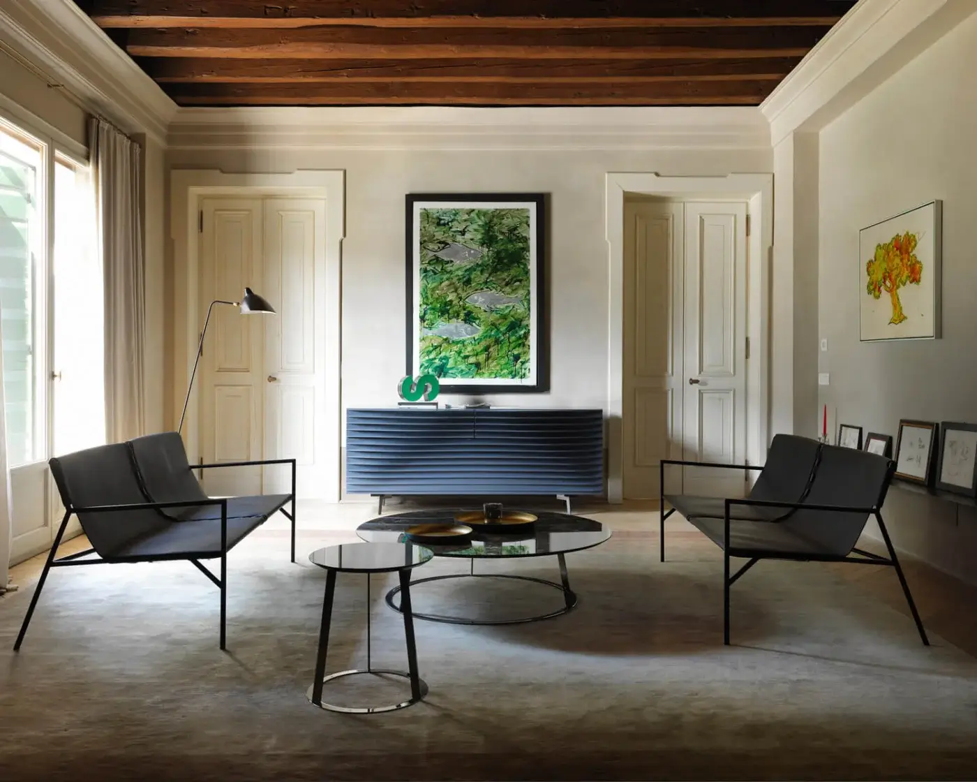 Distinguished Horm Albino Family coffee table and side table with dark glass tops and sleek black metal frames in matte finish