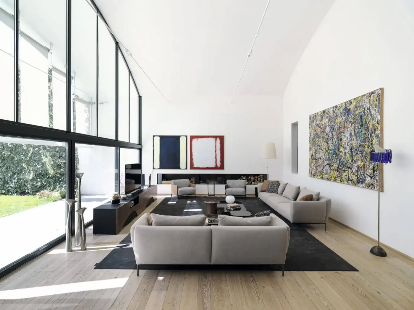 Superior Horm Ella sofa, a graceful seating option with light grey woven fabric and matte finish supported by dark metal legs