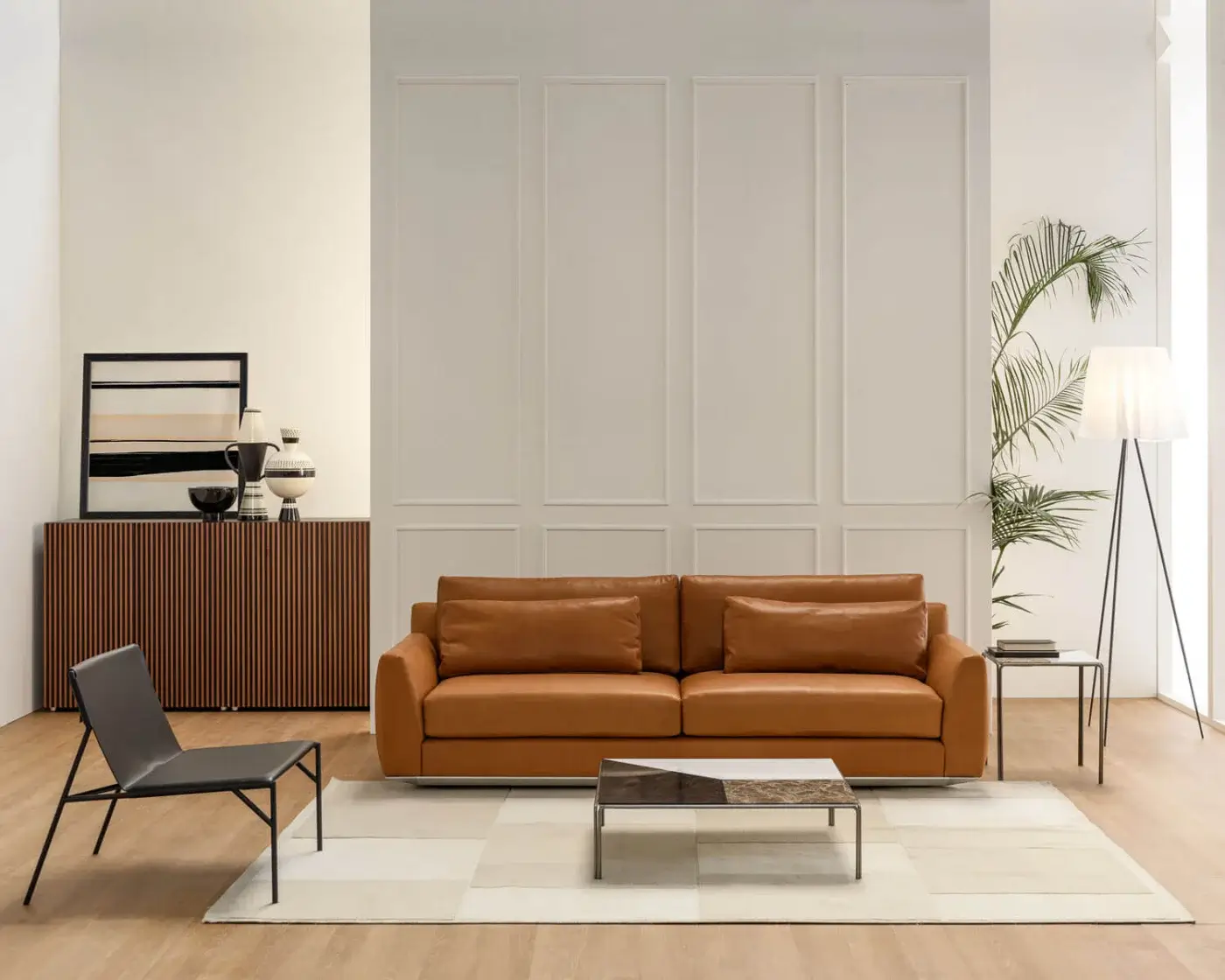 Superior Horm Ellington sofa with smooth light brown leather upholstery and a low profile aluminum frame