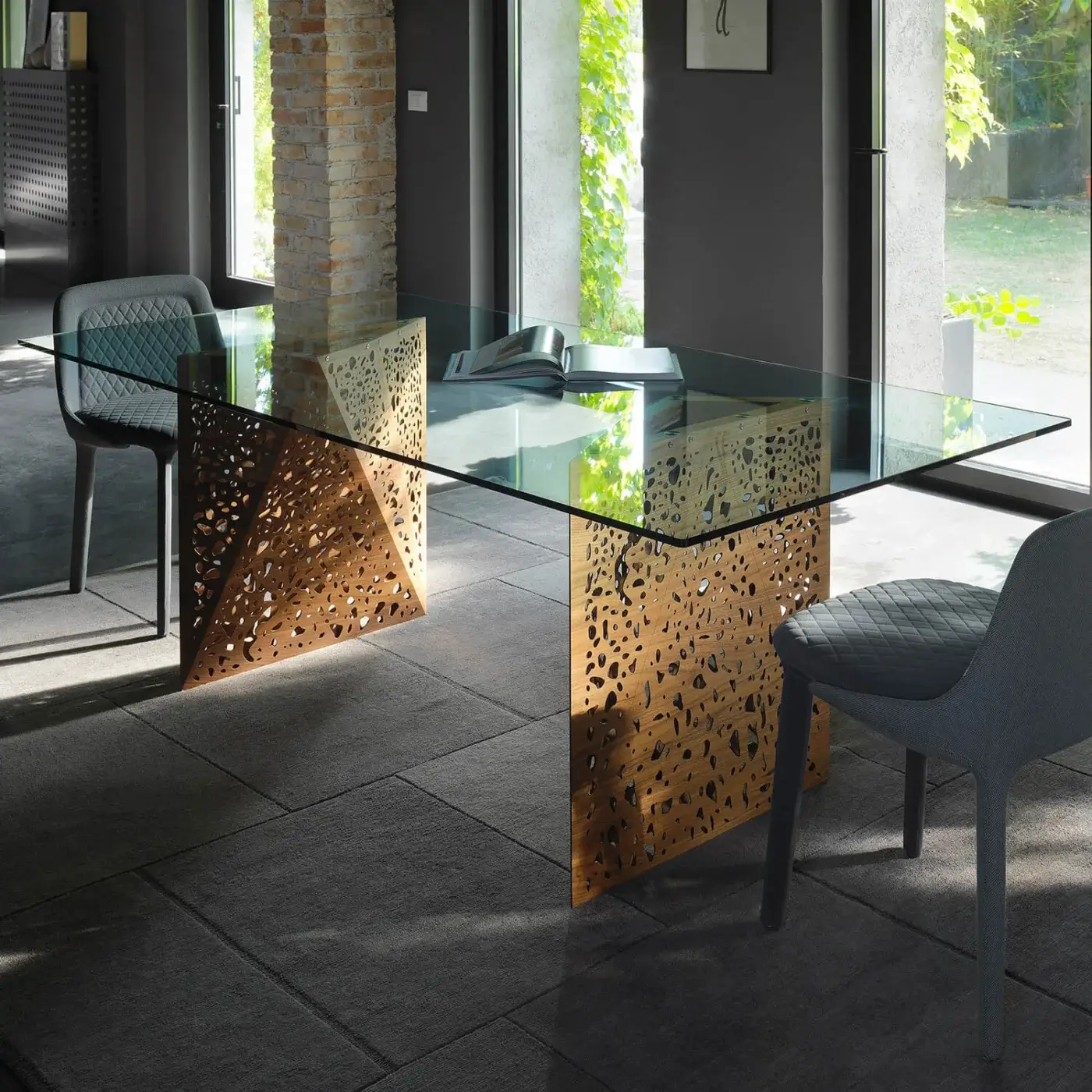 Avant-garde Horm Riddled table crafted in Italy with a glass top and warm wood legs inspired by architectural porosity
