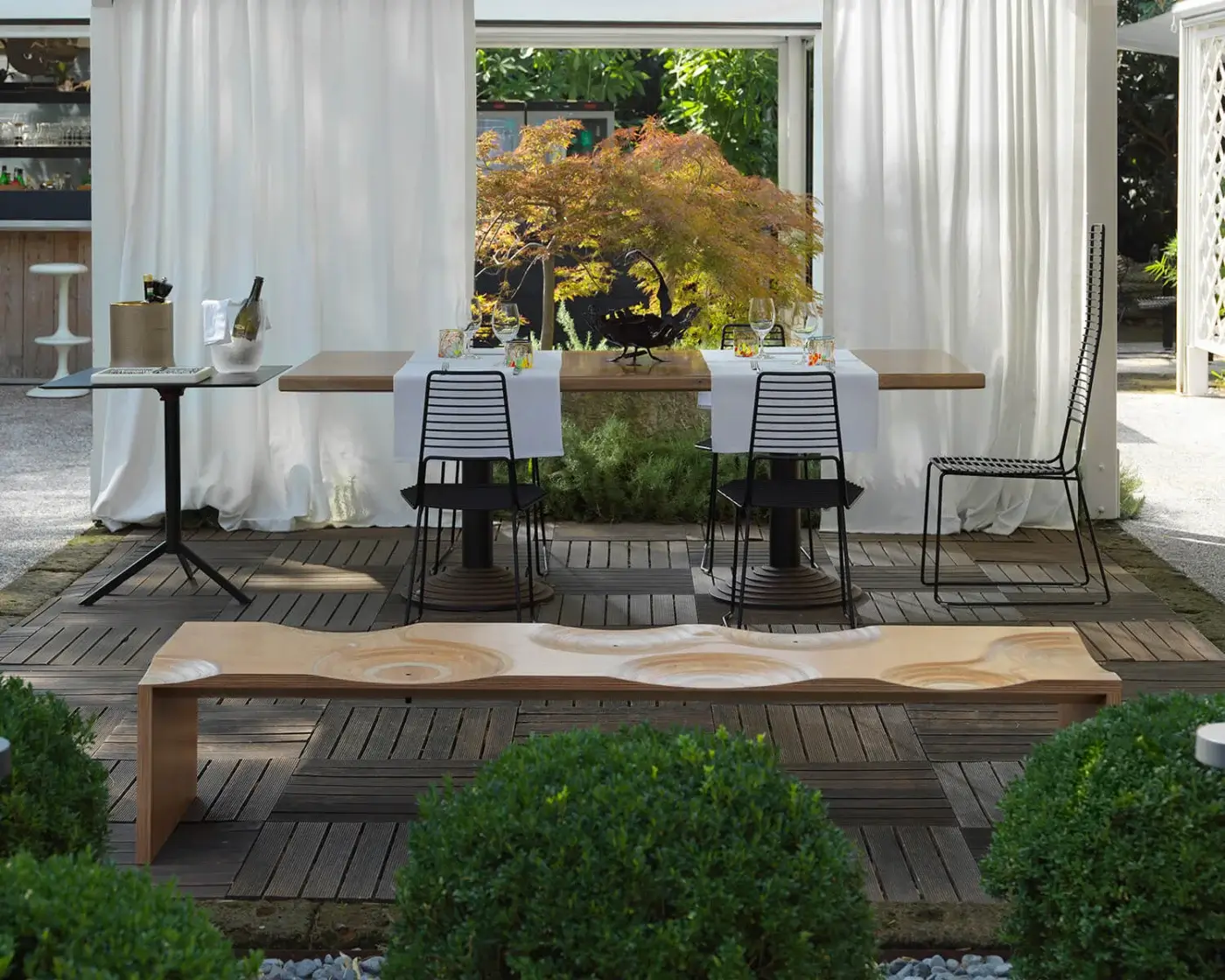 Exceptional Horm Ripples bench crafted in okoume wood with smooth finish and captivating undulating patterns evoking topographical contour lines