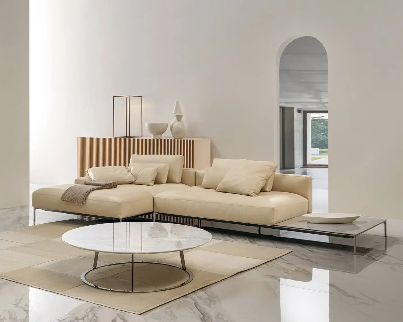 Elegant Horm Dizzy sectional with light beige smooth upholstery and dark metal frame, built with modular components