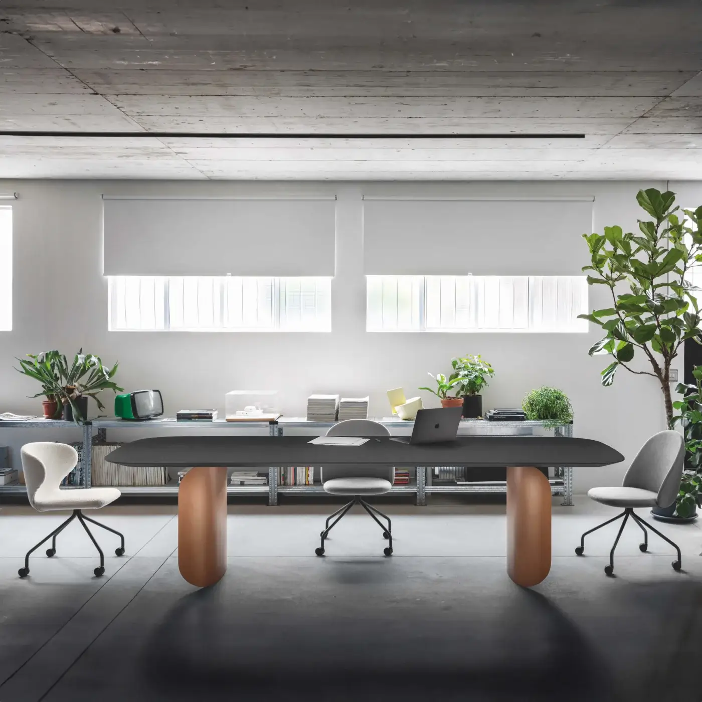 Distinguished Miniforms Barry table with a dark grey matte tabletop and smooth copper-toned cylindrical pedestals crafted in Italy