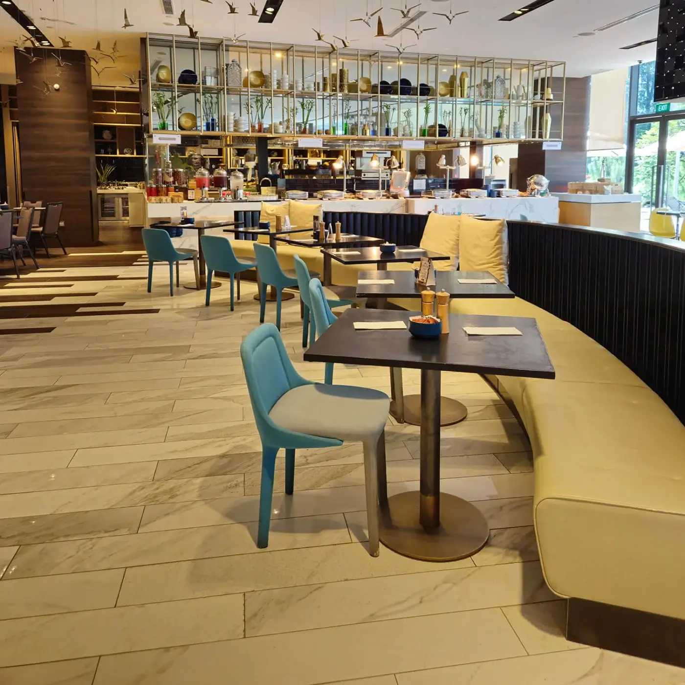 Sophisticated Casamania Lepel chair built with light gray fabric and a light blue frame exhibiting brushed metal legs