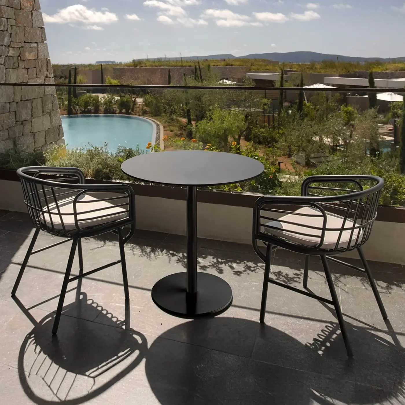 Exceptional Casamania Raphia armchair crafted in painted aluminum with matte black finish and light-colored cushion