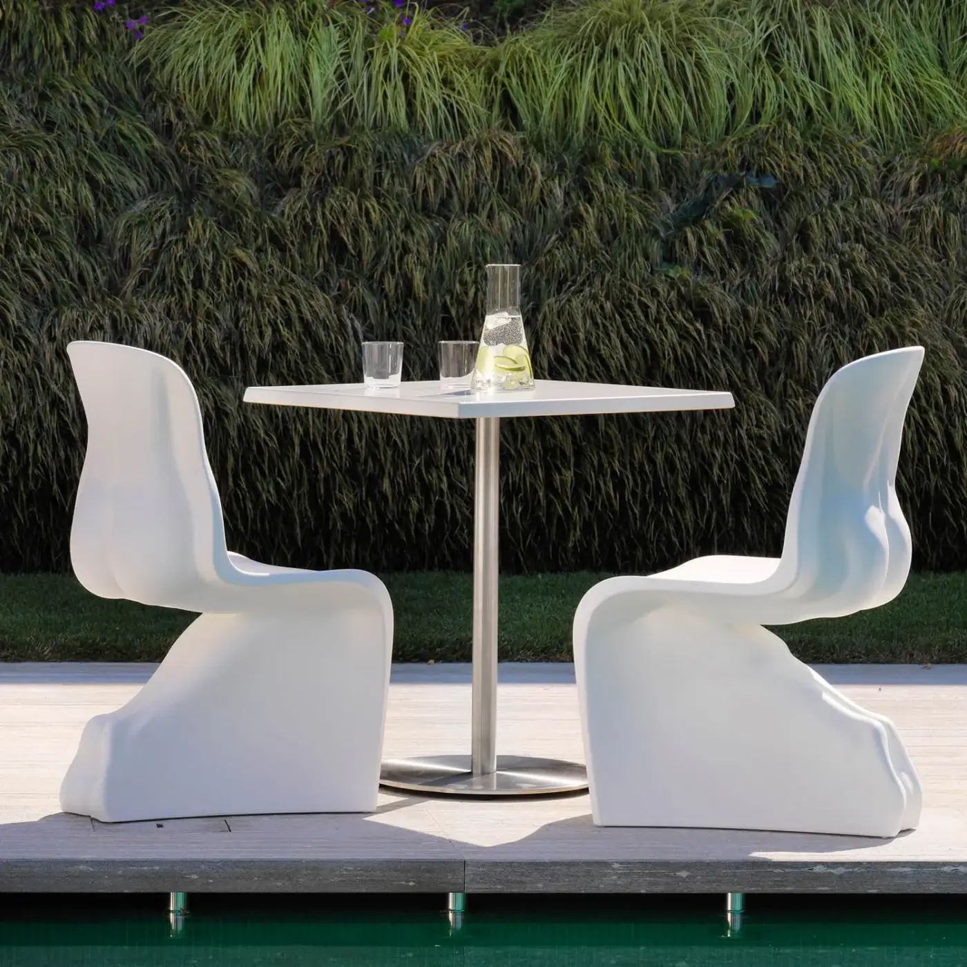 Avant-garde Casamania Him & Her chair crafted in glossy white rotationally molded polyethylene with sculptural form