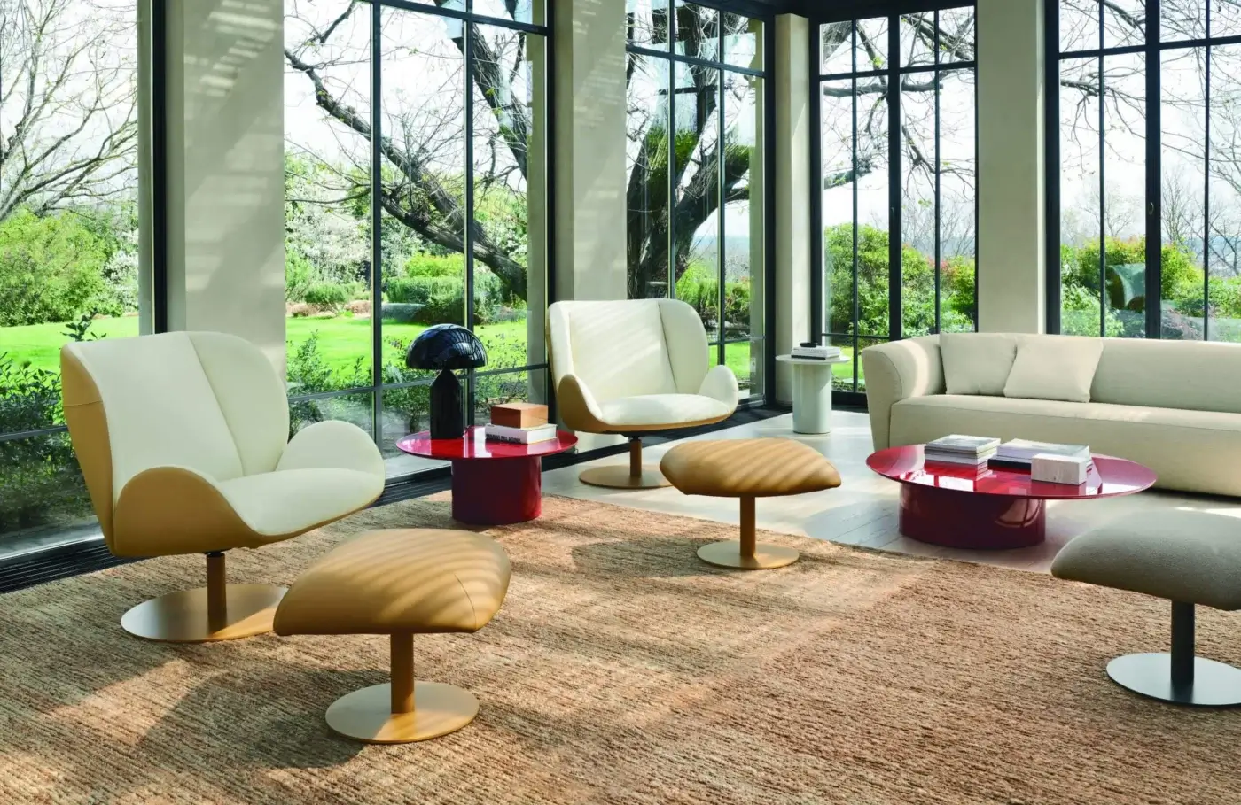 Exceptional Frag Ocean lounge chair with tan leather and off-white textile seating, supported by a central steel swivel base with return mechanism