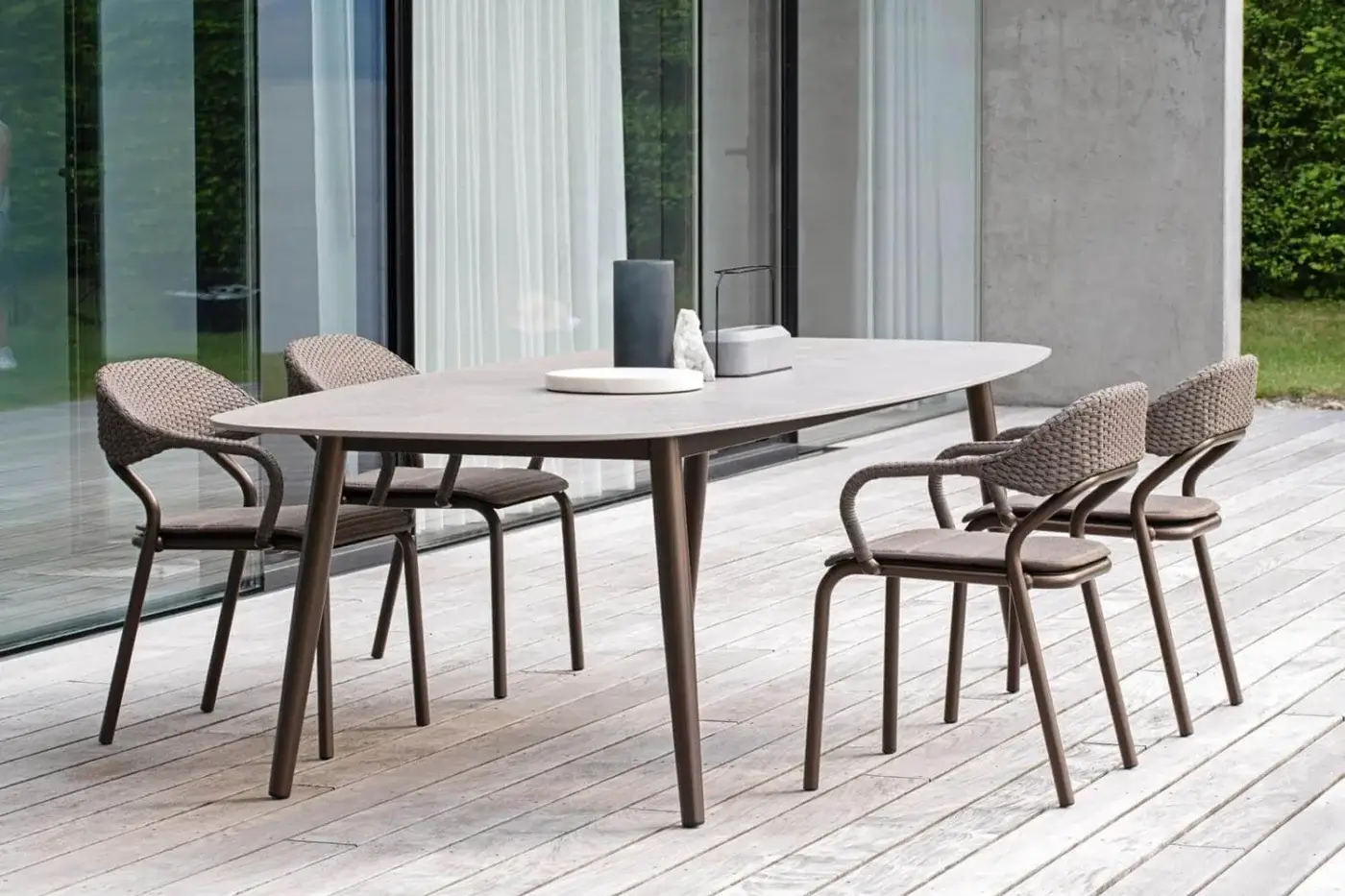 Distinguished Varaschin Noss armchair with aluminum structure and hand-woven brown synthetic fiber rope back