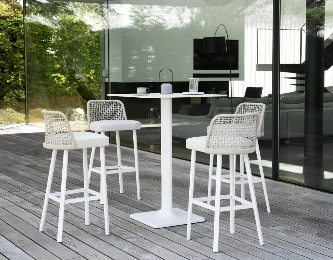Distinguished Varaschin Emma stool with matte white metal frame and light-toned woven backrest in light textile finish