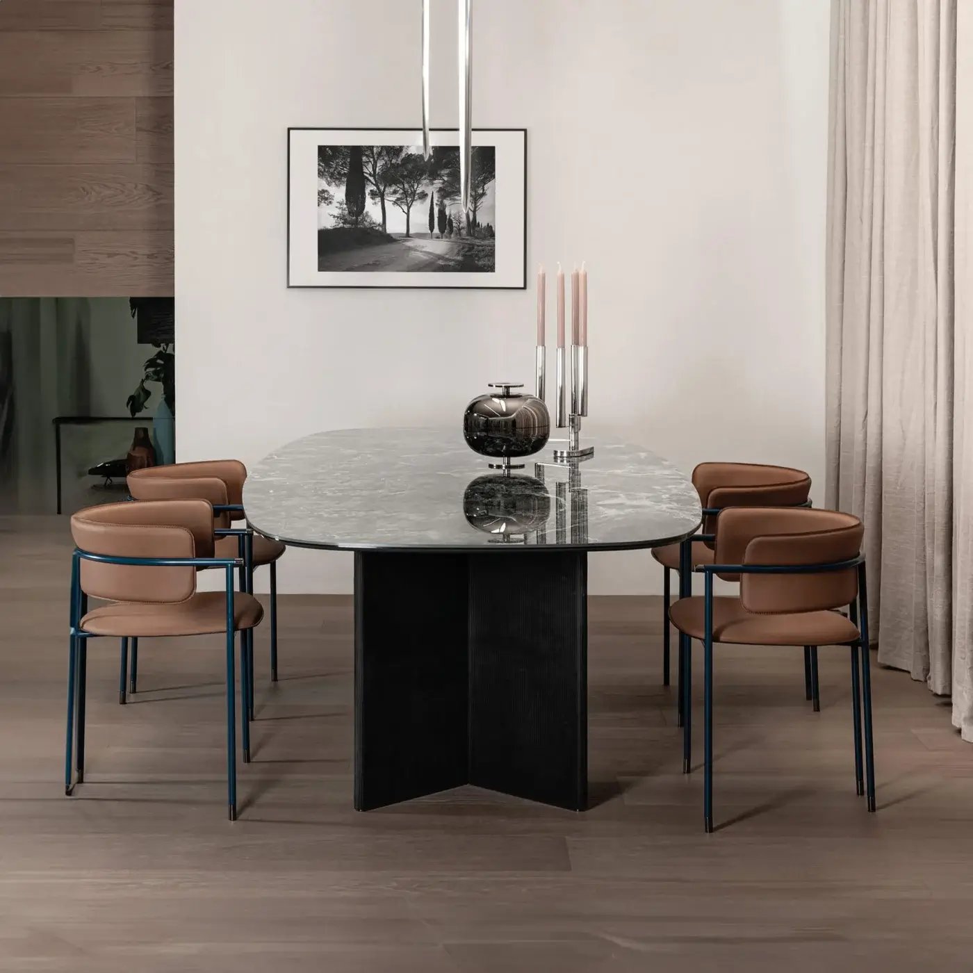 Innovative Cierre1972 Mac armchair with dark metal structure and brown leather upholstery, plus chrome accents