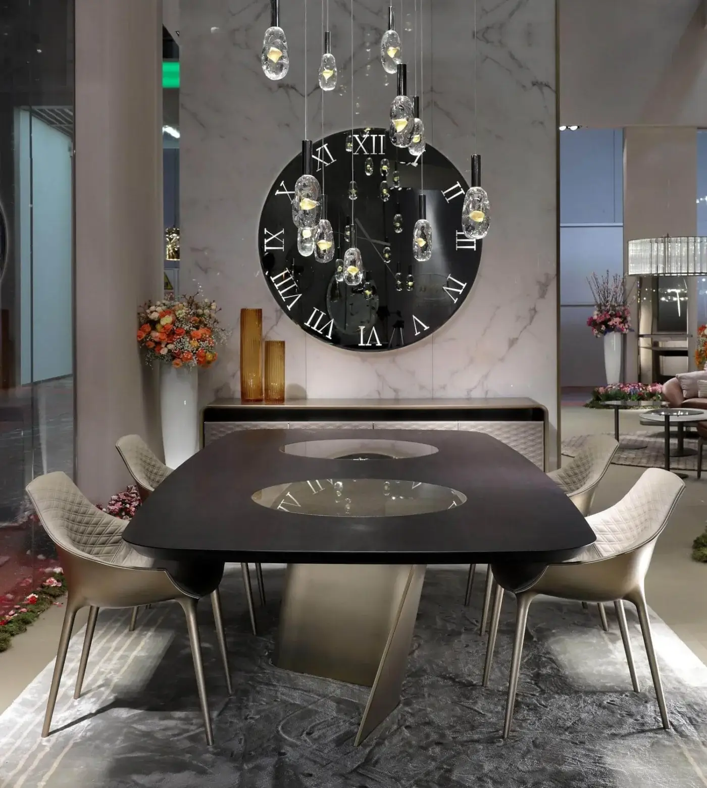 Exclusive Reflex Esse table crafted with Canaletto walnut, curved extra clear glass bases, satin Brass finish and built-in Mesh glass Lazy Susan plates