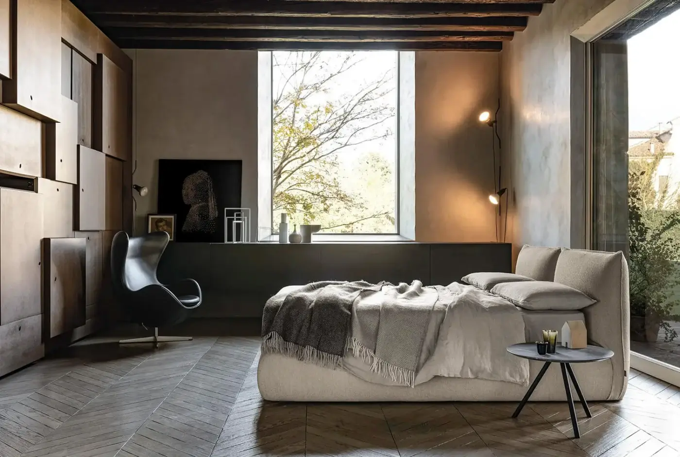 Distinguished Bolzan Letti Venus bed with firwood structure and light beige textile upholstery exhibiting a matte finish