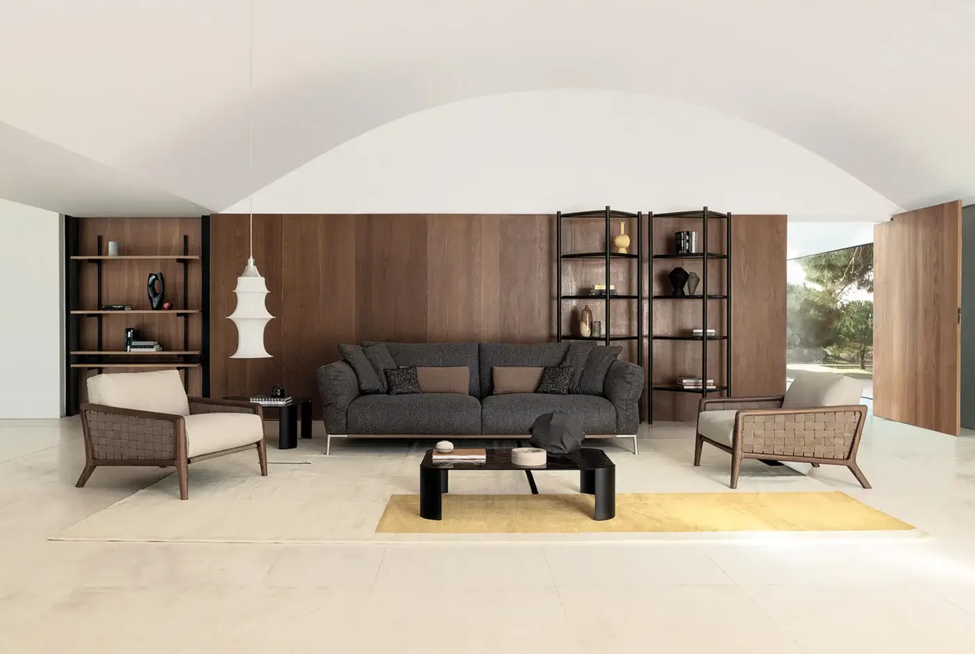 Superior Cierre1972 Chapeau sofa upholstered in textured dark gray textile with curved back and rounded armrests