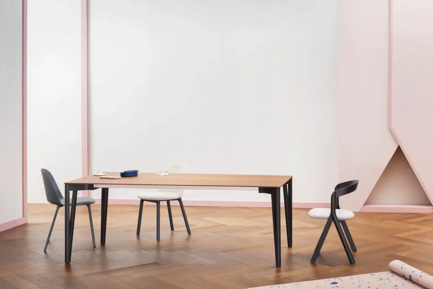 Elegant Miniforms Decapo table with light brown wooden top and slender dark V-shaped legs crafted in Italy