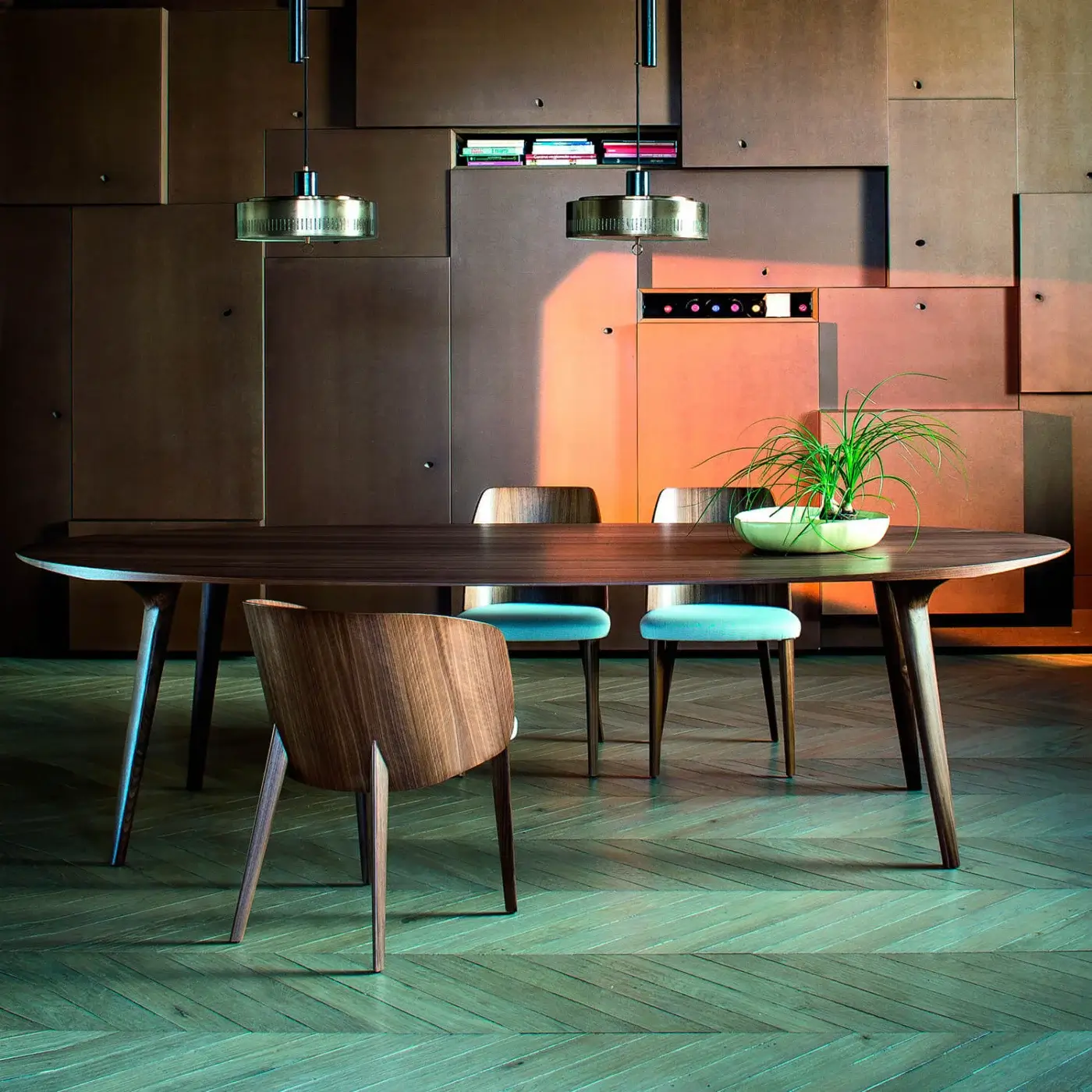 Elegant Bross Shell table with elongated oval top in wood and dark brown finish crafted with subtly tapered legs