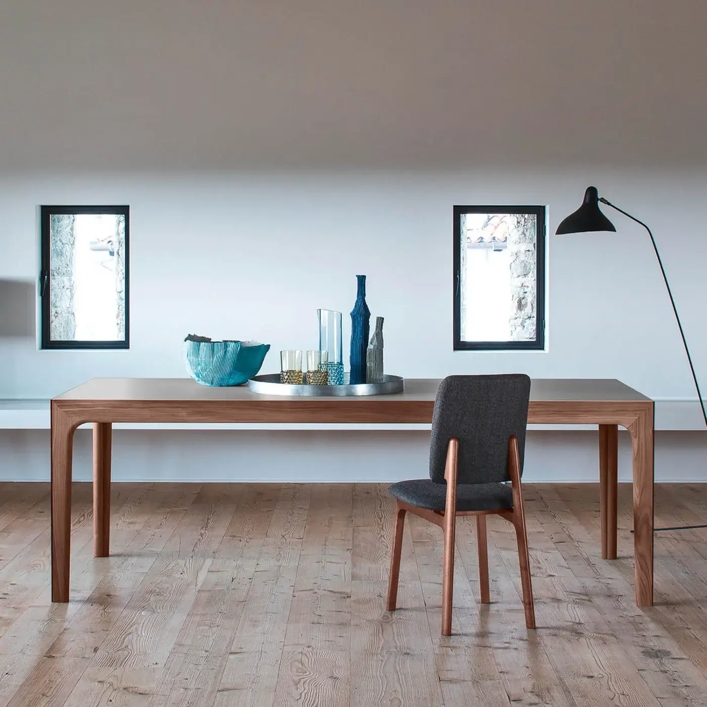Distinguished Bross Gisa table with warm medium-toned wood and a smooth light-colored surface showcasing Italian craftsmanship