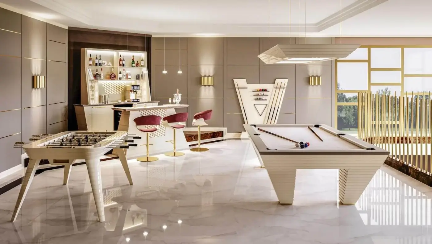 Vismara pool table, cream frame, geometric details, with burgundy velvet bar stools, gold legs, and built-in cream bar backdrop.