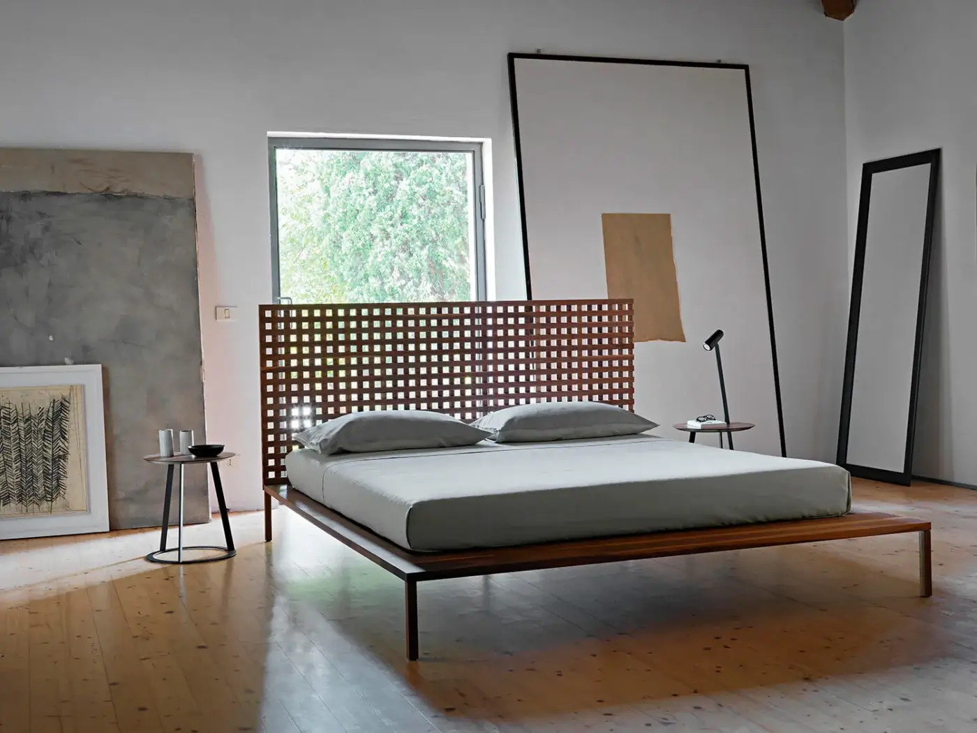 Distinguished Horm Yume Black mirror crafted in Italy with a slim, black painted aluminum frame and reflective surface
