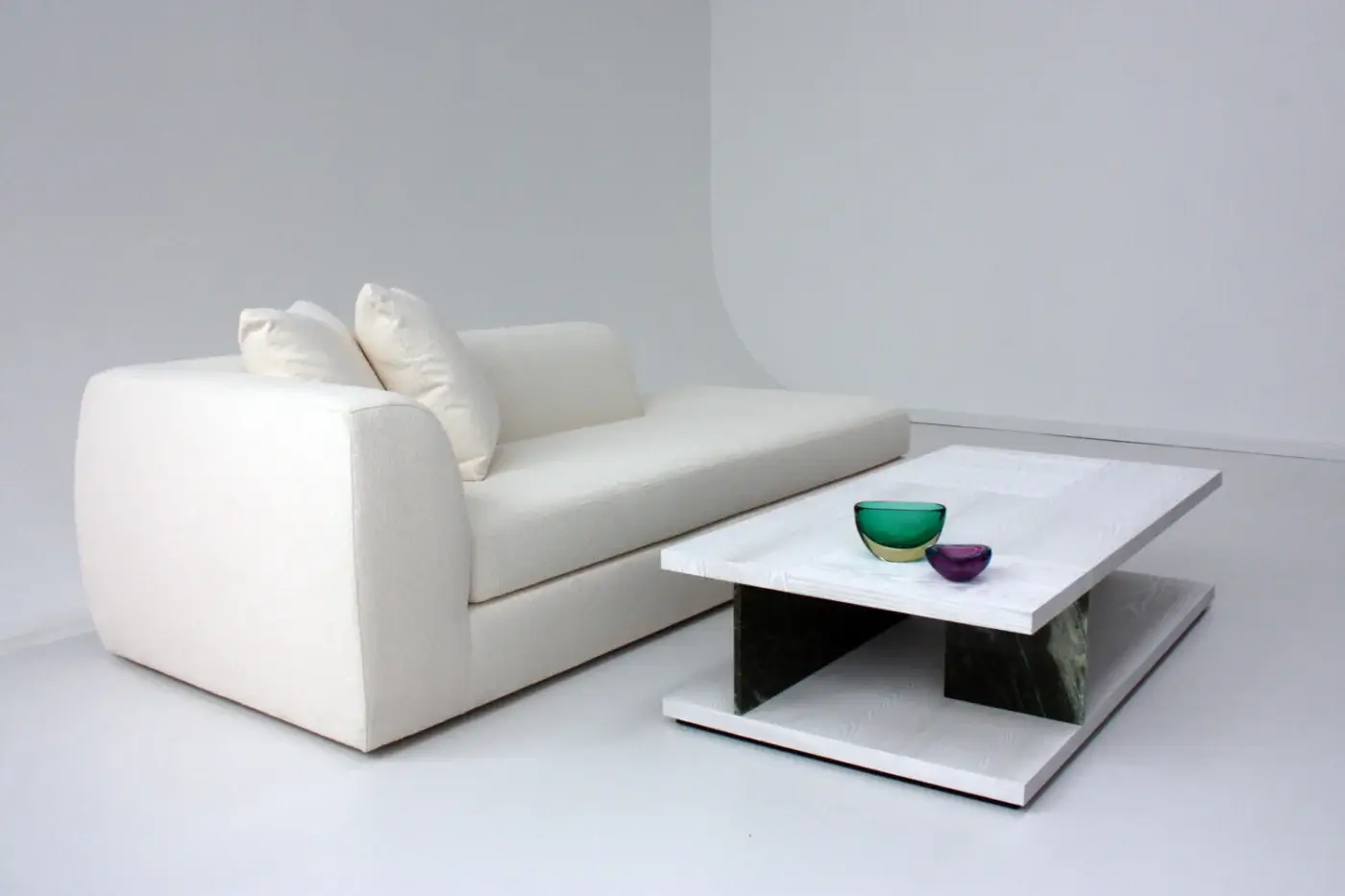 Architectural Casa Casati Barcelona coffee table crafted with white wood grain and dark textured supports