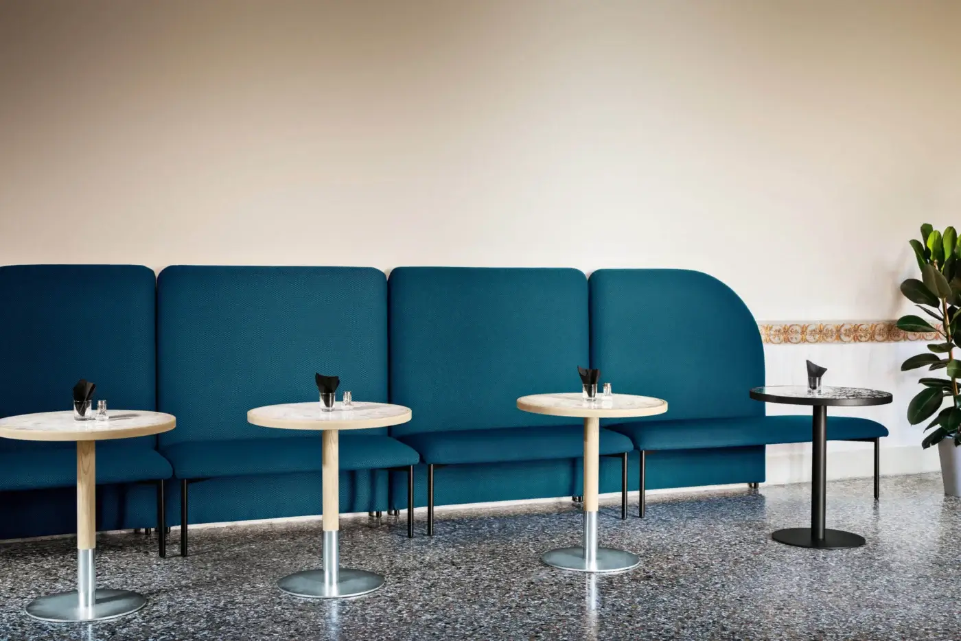 Distinguished Miniforms Marino bench with connected modules upholstered in blue textile and slender dark metal legs