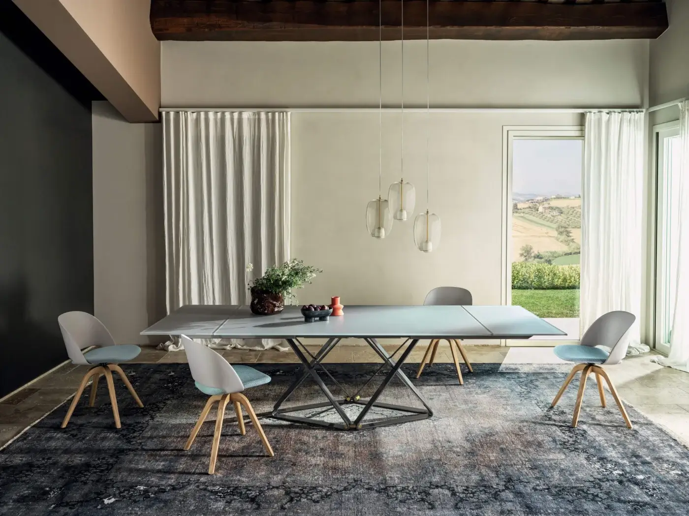 Distinguished Bontempi Delta table with light gray tabletop and dark metal geometric base exhibiting a smooth matte finish