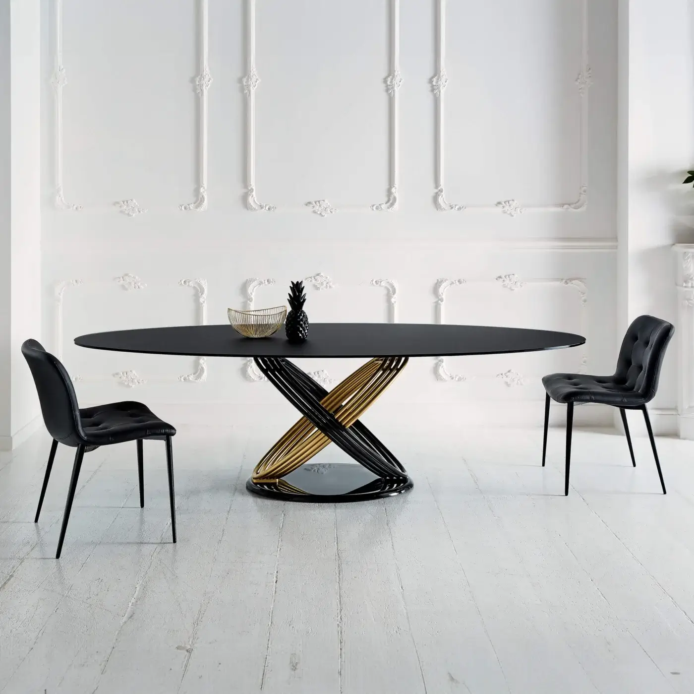 Distinctive Bontempi Fusion table with interwoven black and gold metal base supporting a smooth dark tabletop