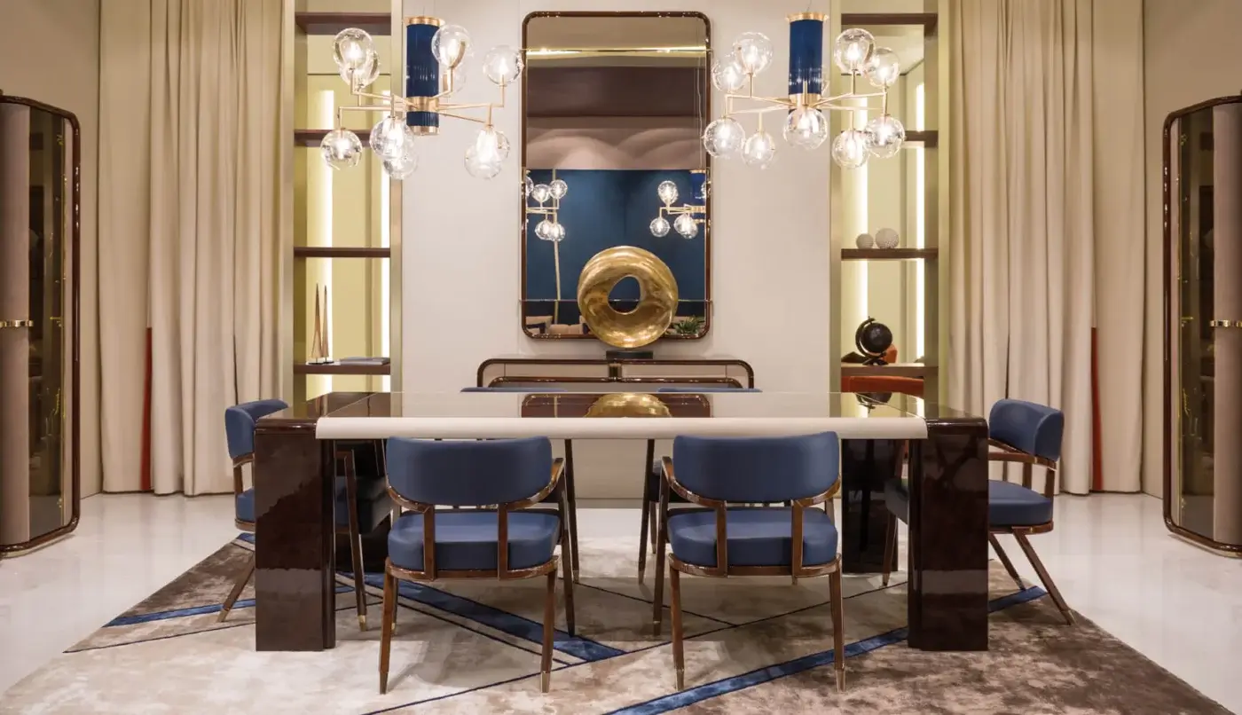 Lavish Turri Madison armchair showcases geometric shaping upholstered in vibrant blue textile with light gold metal feet and glossy dark brown wood