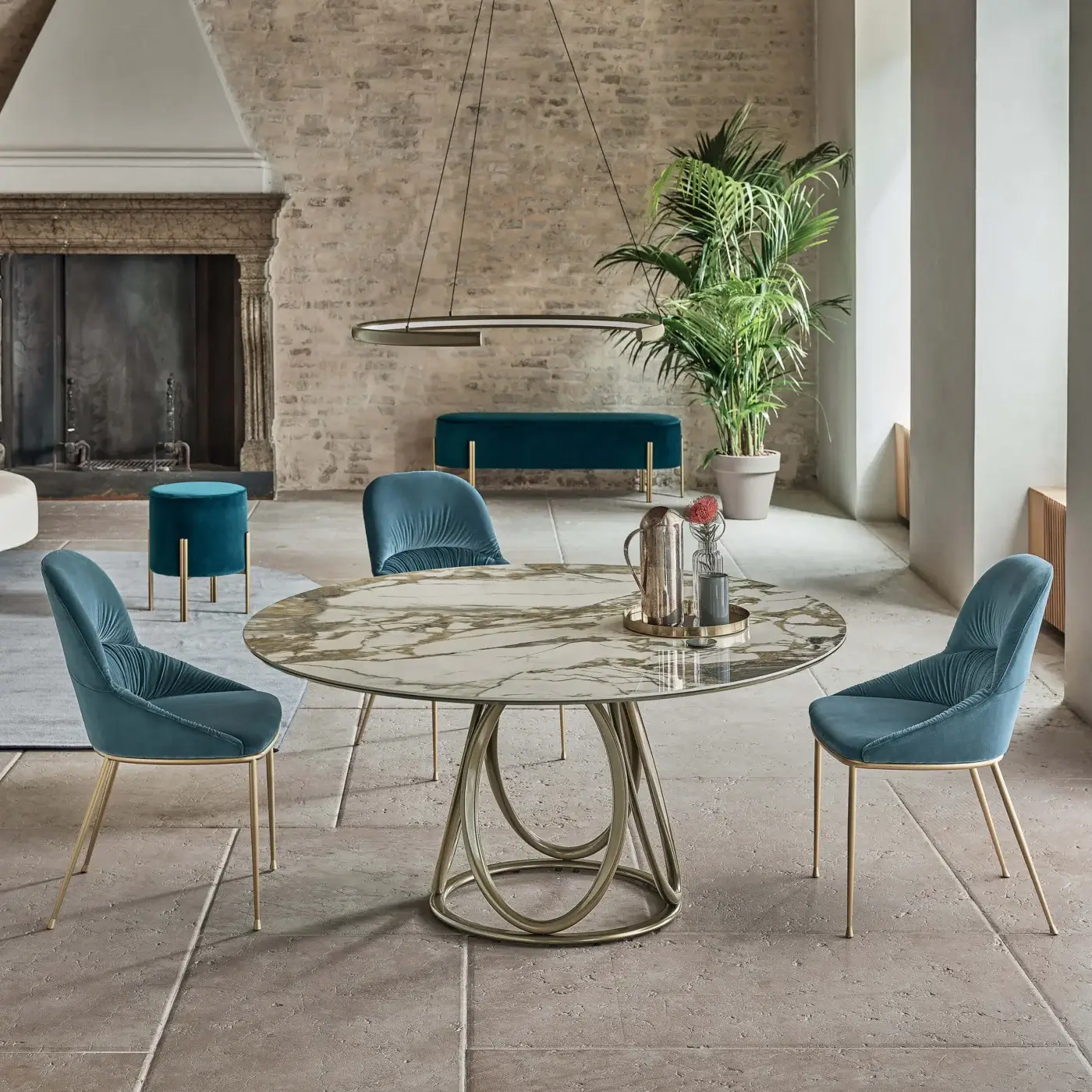 Exceptional Bontempi Louis round table with a light beige faux-marble top and stark metal ovals built with a sleek glass surface