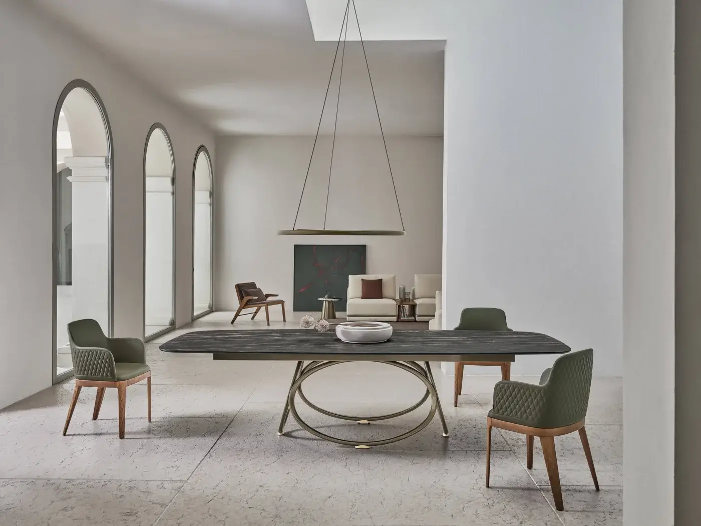 Distinguished Bontempi Louis Barrel table with intersecting oval metal rings and a dark-toned elongated rectangular top