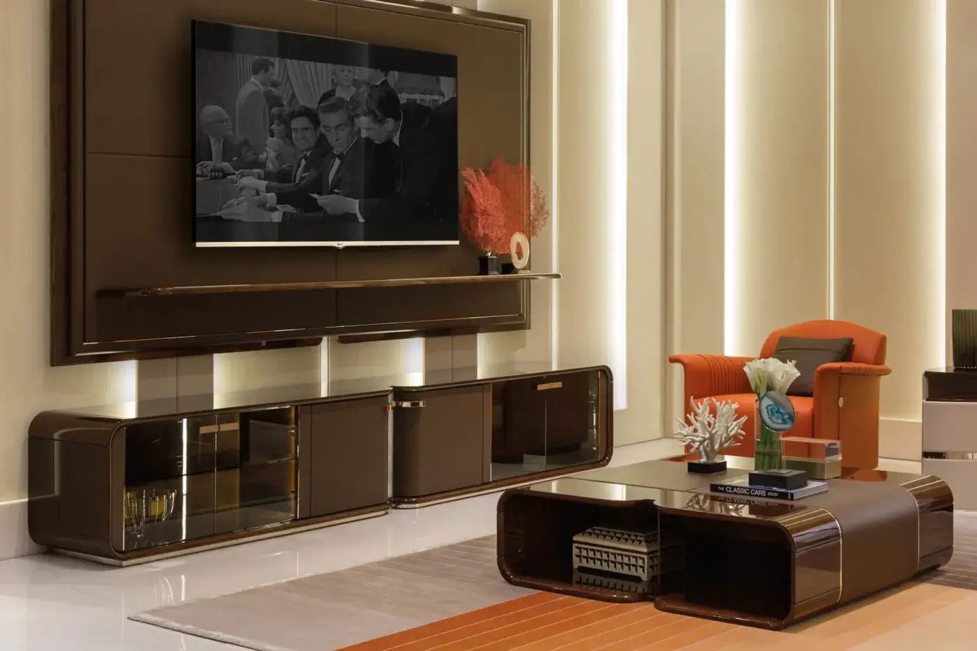 Superior Turri Madison coffee table crafted with curved wood, light gold details, glossy dark brown veneer, and a leather band