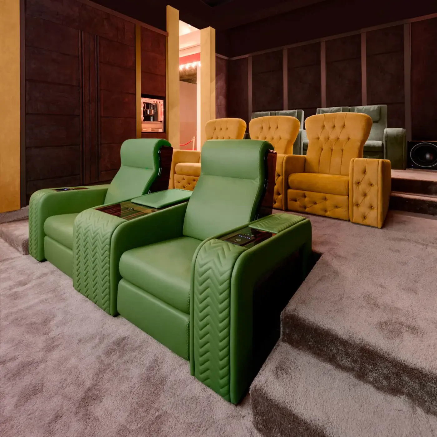 Vismara home cinema seating, green chevron leather front row, mustard yellow tufted back row, dark wood paneled theater, recessed lighting.