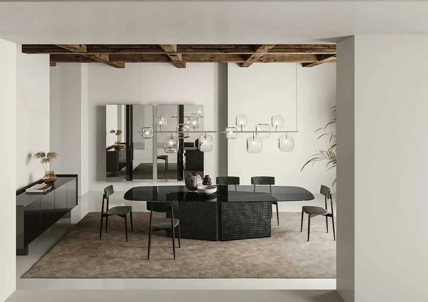 Black glass Tonelli Bow dining table with woven base, surrounded by eight green upholstered metal chairs, under a spherical glass chandelier.