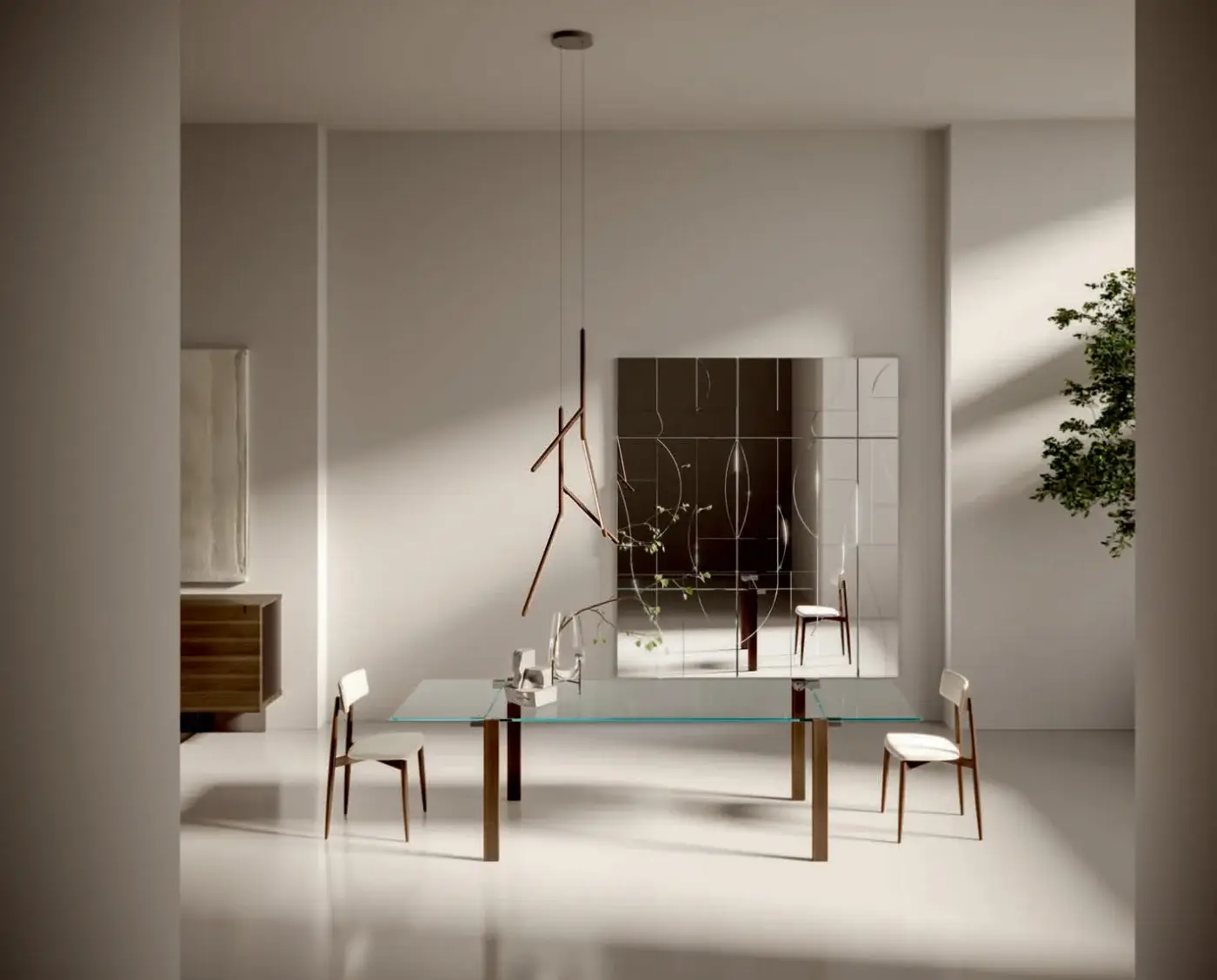 Glass dining table with brown wood base, surrounded by beige upholstered chairs, beneath a bronze pendant light and grid artwork.