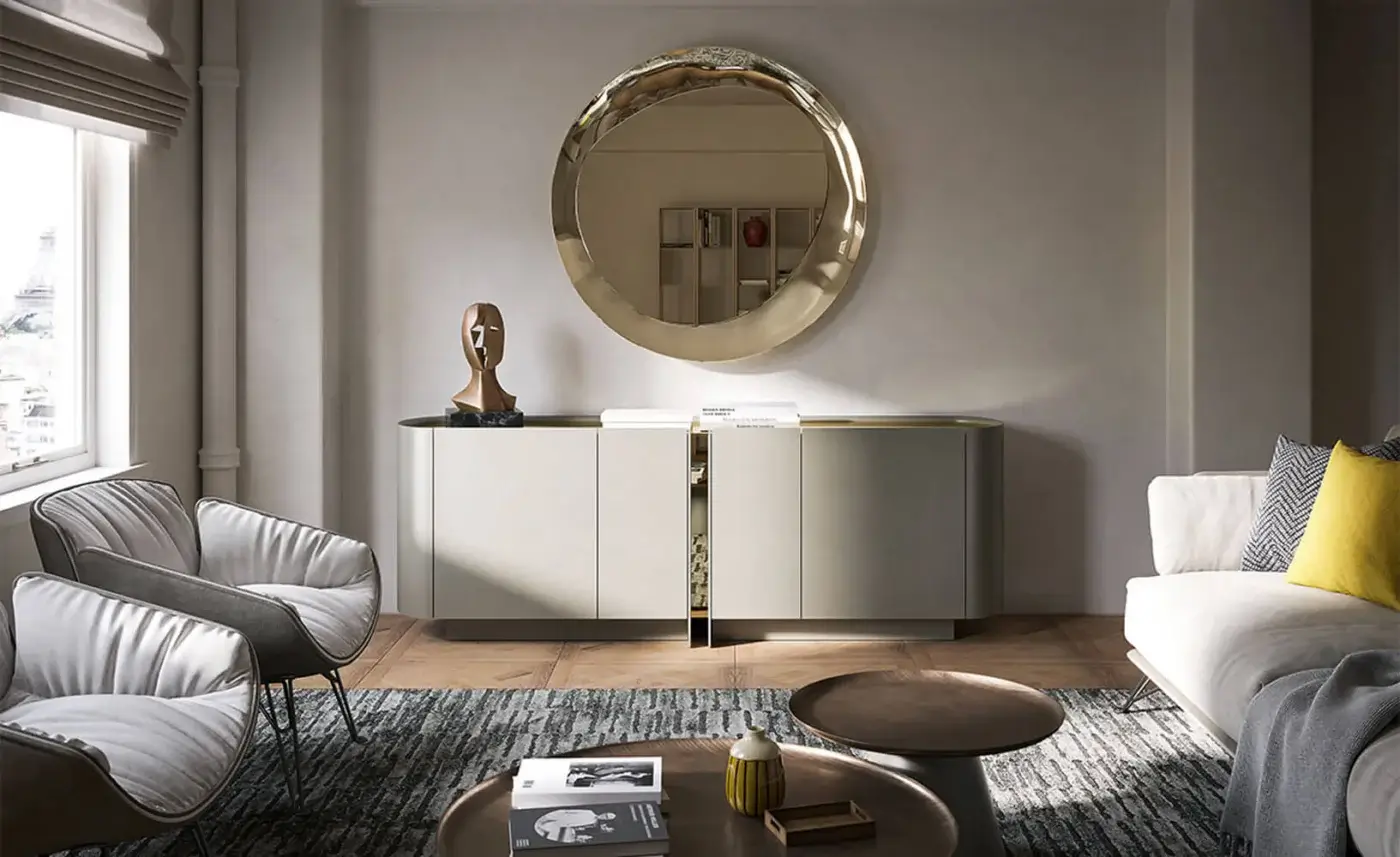 Cattelan Italia Dynasty sideboard, light gray matte finish, gold accent, paired with round gold-framed mirror and neutral living room decor.