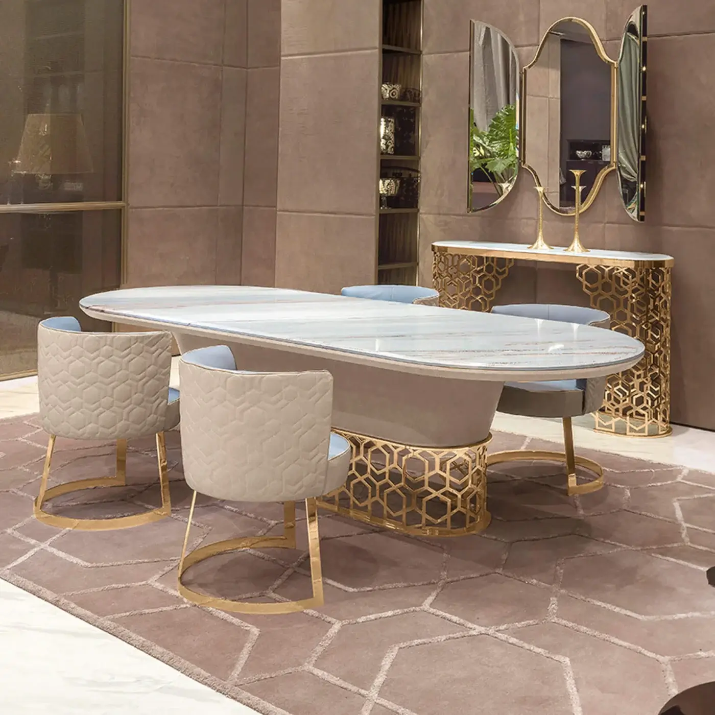 Elegant Longhi Clairmont table with stone-like top and gold-tone laser-cut metal base displaying curved decoration