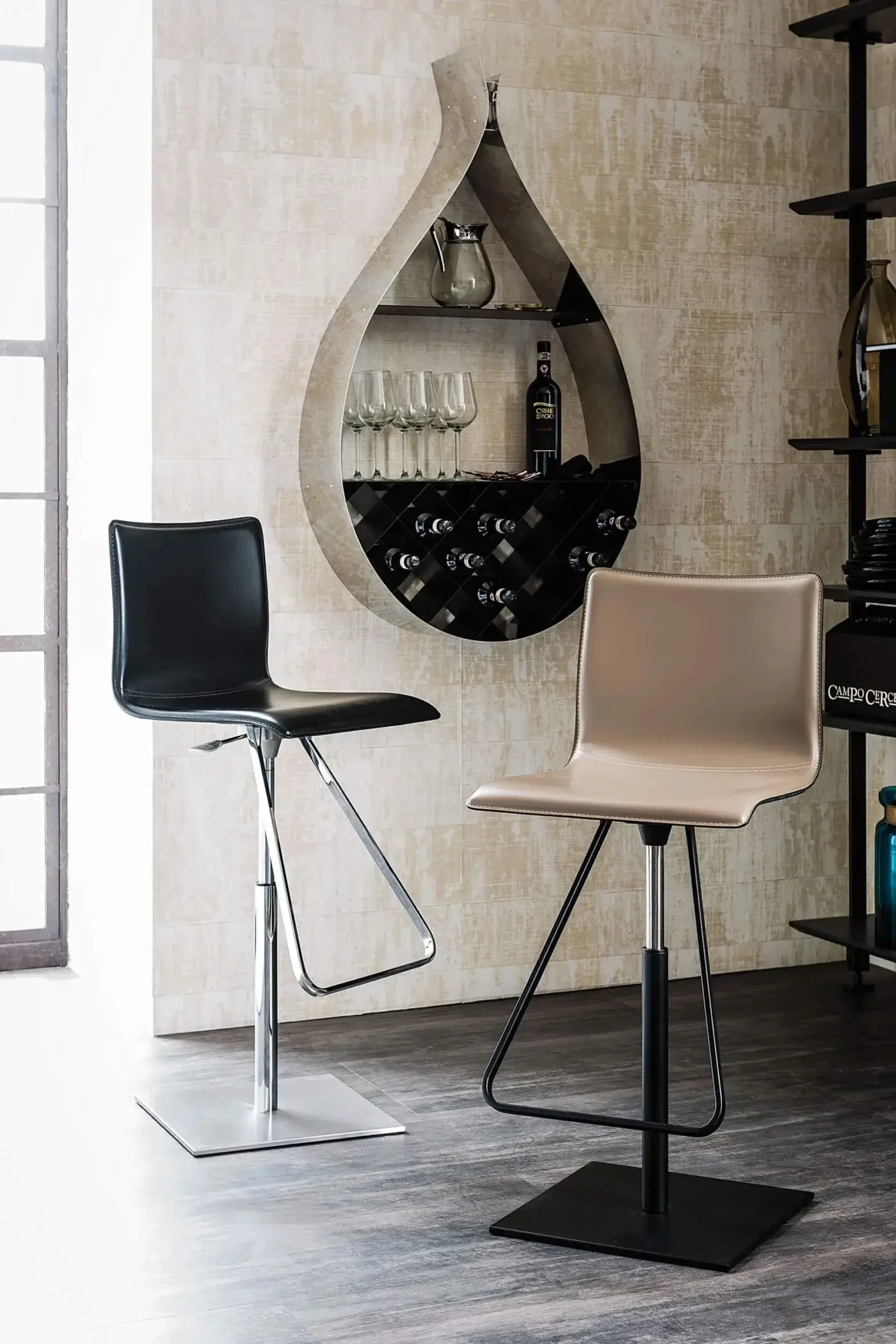 Cattelan Italia Toto stools, beige & black leather, chrome base with gas lift, positioned before dark gray teardrop wine rack.