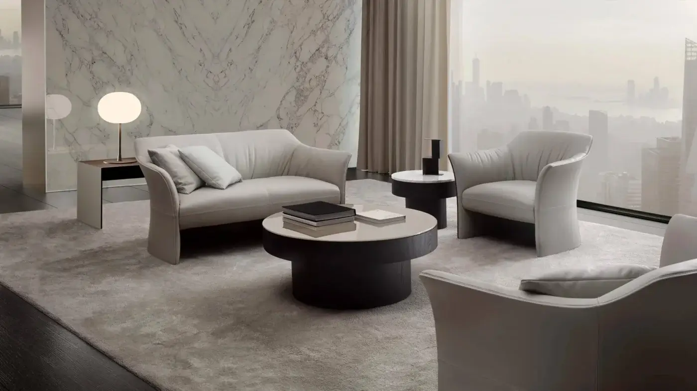 Lavish 4 Mariani Sella lounge chair with soft light gray textile upholstery and continuously enveloping form