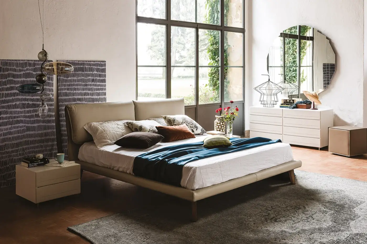 Cattelan Italia Adam bed, beige upholstered, ribbed headboard, with wood frame, styled bedroom scene, natural light, patterned rug.