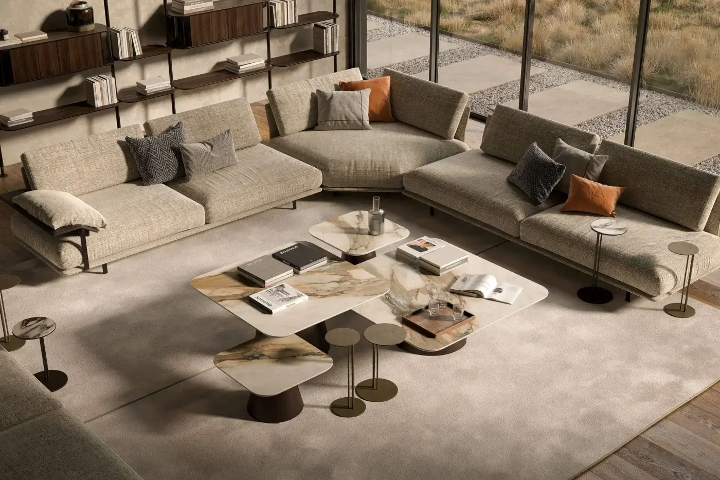 Cattelan Italia coffee table, marble top with beige, brown, and grey veining, cylindrical dark brown base, surrounded by light beige modular sofas.